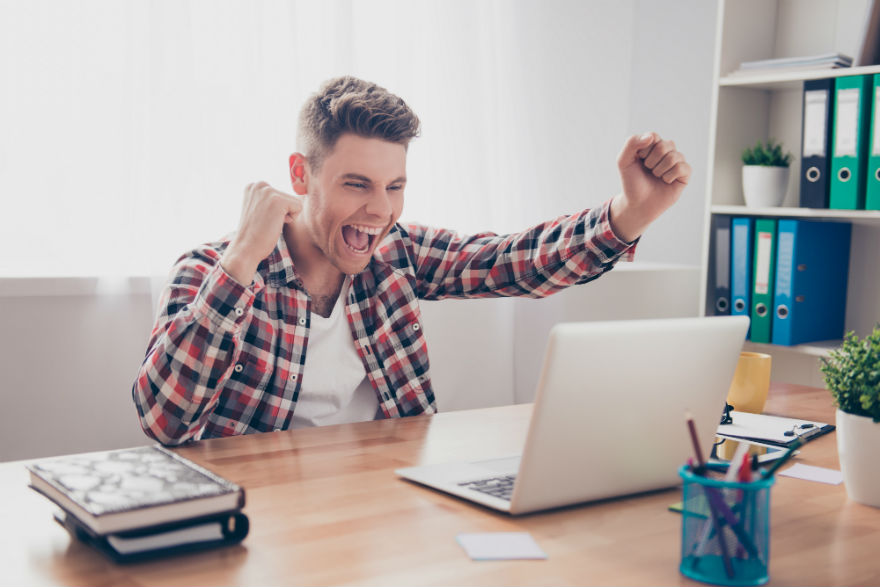 Happy man with laptop